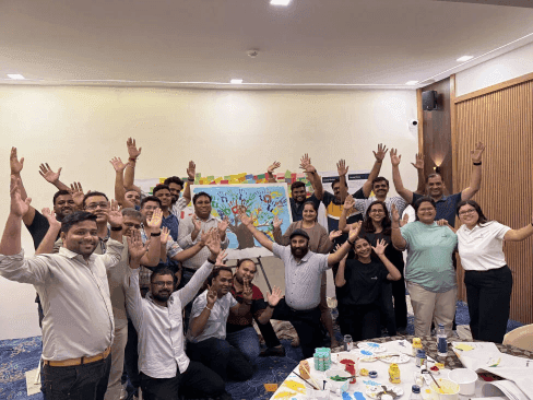 enreap teammates collaborating and celebrating